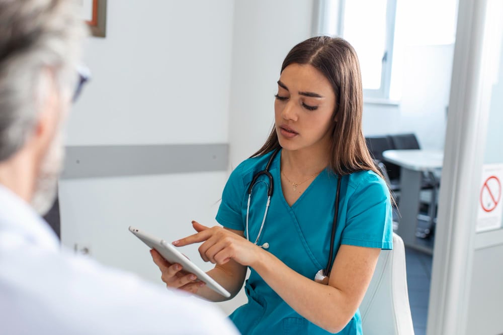 Doctor handing a medical record to a patient in a modern clinic.