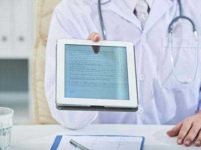 A-doctor-handing-in-a-medical-record-file-1536x1025