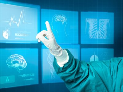 Hand-in-medical-glove-pointing-to-virtual-screen-medical-technology