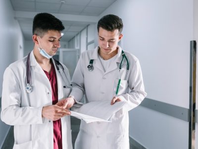 two-young-doctors-holding-a-medical-record